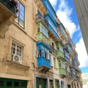 random street with colourful balconies valletta malta