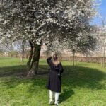 A girl smelling blossoming tree in Copenhagen